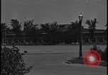 Image of Young men and women punch  time clock at Ford facility Dearborn Michigan  USA, 1938, second 15 stock footage video 65675078259