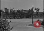 Image of Young men and women punch  time clock at Ford facility Dearborn Michigan  USA, 1938, second 16 stock footage video 65675078259