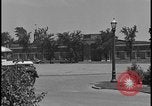 Image of Young men and women punch  time clock at Ford facility Dearborn Michigan  USA, 1938, second 17 stock footage video 65675078259