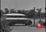 Image of Young men and women punch  time clock at Ford facility Dearborn Michigan  USA, 1938, second 19 stock footage video 65675078259