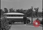 Image of Young men and women punch  time clock at Ford facility Dearborn Michigan  USA, 1938, second 21 stock footage video 65675078259