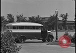 Image of Young men and women punch  time clock at Ford facility Dearborn Michigan  USA, 1938, second 22 stock footage video 65675078259
