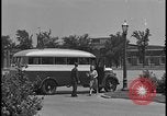 Image of Young men and women punch  time clock at Ford facility Dearborn Michigan  USA, 1938, second 26 stock footage video 65675078259