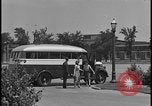 Image of Young men and women punch  time clock at Ford facility Dearborn Michigan  USA, 1938, second 27 stock footage video 65675078259
