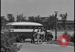 Image of Young men and women punch  time clock at Ford facility Dearborn Michigan  USA, 1938, second 28 stock footage video 65675078259