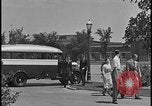 Image of Young men and women punch  time clock at Ford facility Dearborn Michigan  USA, 1938, second 36 stock footage video 65675078259