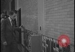 Image of Young men and women punch  time clock at Ford facility Dearborn Michigan  USA, 1938, second 44 stock footage video 65675078259
