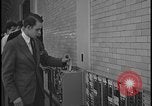 Image of Young men and women punch  time clock at Ford facility Dearborn Michigan  USA, 1938, second 45 stock footage video 65675078259