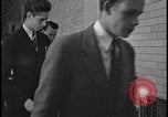 Image of Young men and women punch  time clock at Ford facility Dearborn Michigan  USA, 1938, second 49 stock footage video 65675078259