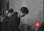 Image of Young men and women punch  time clock at Ford facility Dearborn Michigan  USA, 1938, second 57 stock footage video 65675078259