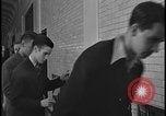Image of Young men and women punch  time clock at Ford facility Dearborn Michigan  USA, 1938, second 58 stock footage video 65675078259