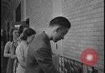 Image of Young men and women punch  time clock at Ford facility Dearborn Michigan  USA, 1938, second 62 stock footage video 65675078259