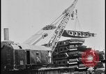 Image of ship hull pieces flattened for recycling into cars Dearborn Michigan USA, 1928, second 9 stock footage video 65675078285