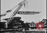 Image of ship hull pieces flattened for recycling into cars Dearborn Michigan USA, 1928, second 16 stock footage video 65675078285