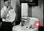 Image of boy washing face Kansas City Missouri USA, 1922, second 62 stock footage video 65675078310