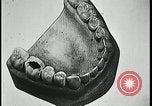 Image of woman with apron clearing plates Kansas City Missouri USA, 1922, second 10 stock footage video 65675078311
