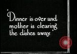 Image of woman with apron clearing plates Kansas City Missouri USA, 1922, second 27 stock footage video 65675078311