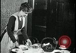 Image of woman with apron clearing plates Kansas City Missouri USA, 1922, second 34 stock footage video 65675078311