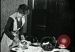 Image of woman with apron clearing plates Kansas City Missouri USA, 1922, second 36 stock footage video 65675078311