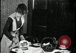 Image of woman with apron clearing plates Kansas City Missouri USA, 1922, second 37 stock footage video 65675078311