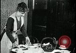 Image of woman with apron clearing plates Kansas City Missouri USA, 1922, second 40 stock footage video 65675078311