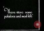 Image of woman with apron clearing plates Kansas City Missouri USA, 1922, second 45 stock footage video 65675078311