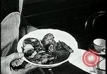 Image of woman with apron clearing plates Kansas City Missouri USA, 1922, second 46 stock footage video 65675078311