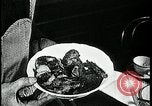 Image of woman with apron clearing plates Kansas City Missouri USA, 1922, second 47 stock footage video 65675078311