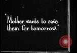 Image of woman with apron clearing plates Kansas City Missouri USA, 1922, second 50 stock footage video 65675078311