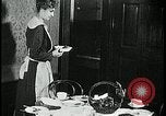 Image of woman with apron clearing plates Kansas City Missouri USA, 1922, second 53 stock footage video 65675078311