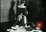 Image of woman with apron clearing plates Kansas City Missouri USA, 1922, second 54 stock footage video 65675078311