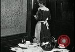 Image of woman with apron clearing plates Kansas City Missouri USA, 1922, second 55 stock footage video 65675078311