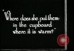Image of woman with apron clearing plates Kansas City Missouri USA, 1922, second 58 stock footage video 65675078311