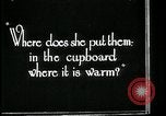Image of woman with apron clearing plates Kansas City Missouri USA, 1922, second 60 stock footage video 65675078311