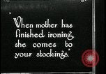 Image of woman darning stockings Kansas City Missouri USA, 1922, second 1 stock footage video 65675078312