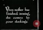 Image of woman darning stockings Kansas City Missouri USA, 1922, second 3 stock footage video 65675078312