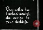 Image of woman darning stockings Kansas City Missouri USA, 1922, second 6 stock footage video 65675078312