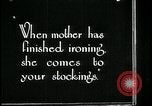 Image of woman darning stockings Kansas City Missouri USA, 1922, second 7 stock footage video 65675078312