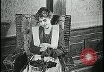 Image of woman darning stockings Kansas City Missouri USA, 1922, second 9 stock footage video 65675078312