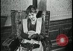 Image of woman darning stockings Kansas City Missouri USA, 1922, second 10 stock footage video 65675078312