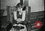 Image of woman darning stockings Kansas City Missouri USA, 1922, second 11 stock footage video 65675078312