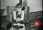 Image of woman darning stockings Kansas City Missouri USA, 1922, second 12 stock footage video 65675078312