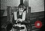 Image of woman darning stockings Kansas City Missouri USA, 1922, second 17 stock footage video 65675078312