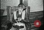Image of woman darning stockings Kansas City Missouri USA, 1922, second 18 stock footage video 65675078312