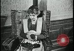 Image of woman darning stockings Kansas City Missouri USA, 1922, second 19 stock footage video 65675078312