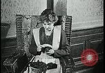 Image of woman darning stockings Kansas City Missouri USA, 1922, second 20 stock footage video 65675078312