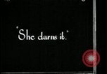 Image of woman darning stockings Kansas City Missouri USA, 1922, second 22 stock footage video 65675078312
