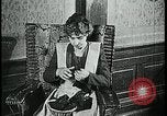 Image of woman darning stockings Kansas City Missouri USA, 1922, second 24 stock footage video 65675078312