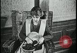 Image of woman darning stockings Kansas City Missouri USA, 1922, second 26 stock footage video 65675078312