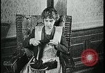 Image of woman darning stockings Kansas City Missouri USA, 1922, second 27 stock footage video 65675078312